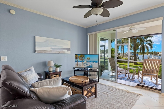 tiled living room featuring plenty of natural light, ceiling fan, and ornamental molding