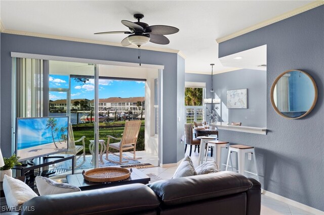 255 Cays Dr Unit 2001, Naples, FL 34114 - living area with baseboards, tile patterned flooring, a ceiling fan, ornamental molding, and a textured wall