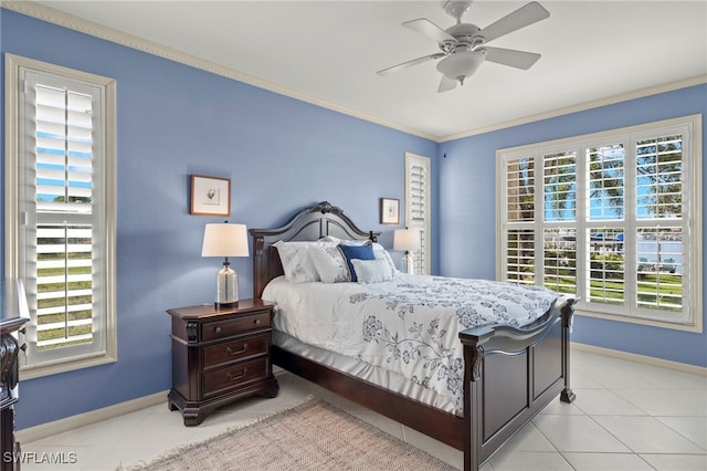 bedroom featuring multiple windows, ceiling fan, crown molding, and light tile patterned flooring