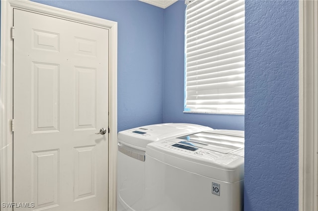 laundry area with independent washer and dryer