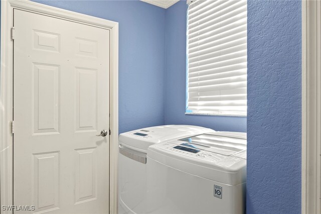 255 Cays Dr Unit 2001, Naples, FL 34114 - washroom featuring independent washer and dryer