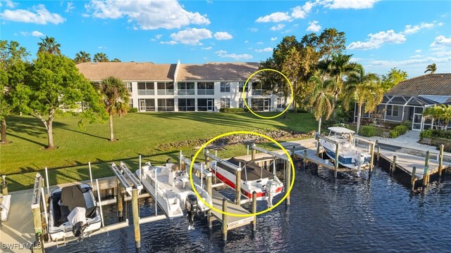 255 Cays Dr Unit 2001, Naples, FL 34114 - dock area with boat lift, a water view, and a lawn
