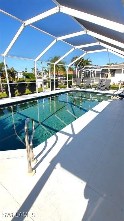 view of pool featuring a patio and a lanai