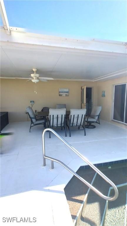 view of swimming pool featuring ceiling fan