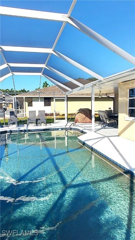 view of pool featuring a lanai and a patio area