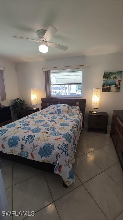 bedroom featuring ceiling fan and light tile patterned floors