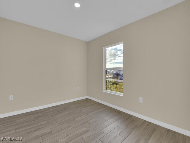 spare room with light hardwood / wood-style floors