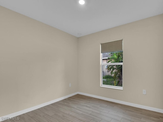 unfurnished room featuring light wood-type flooring