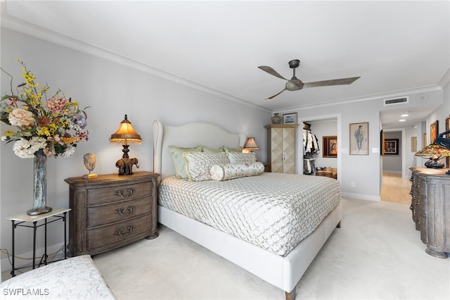 carpeted bedroom with ceiling fan and crown molding