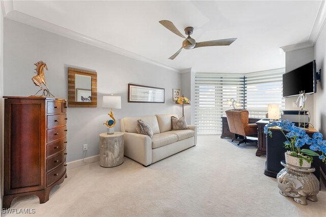 living room with light carpet, ceiling fan, and ornamental molding