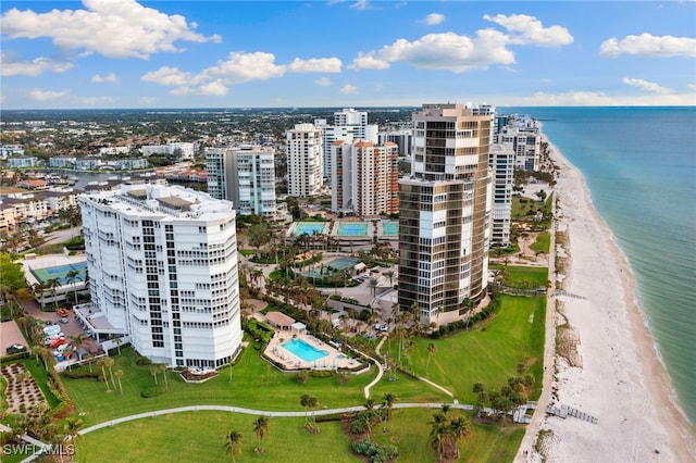 aerial view with a water view and a beach view