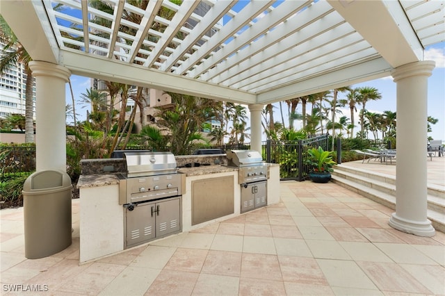 view of patio / terrace with an outdoor kitchen, area for grilling, and a pergola