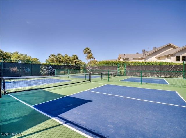 view of sport court with community basketball court and fence