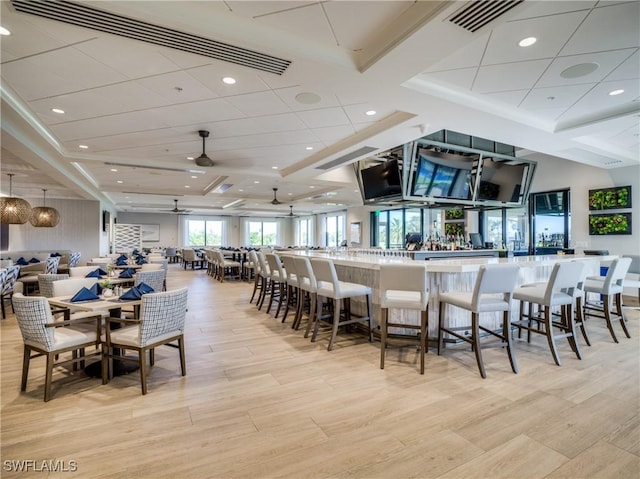 dining area with recessed lighting, visible vents, a ceiling fan, and light wood finished floors