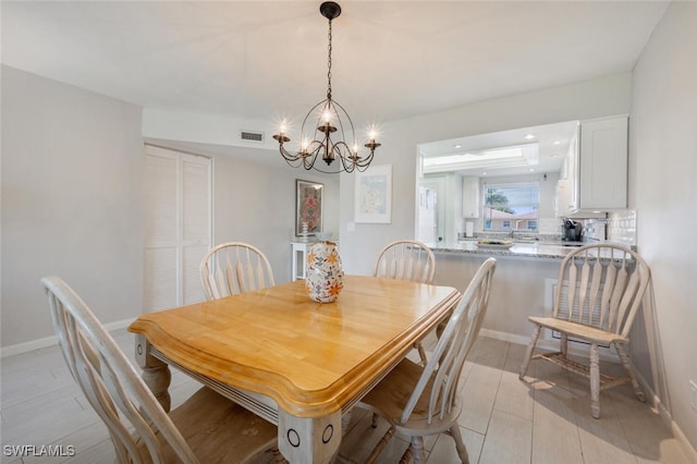 dining room with a chandelier