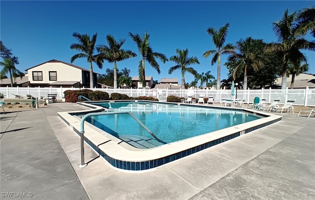 view of swimming pool with a patio area