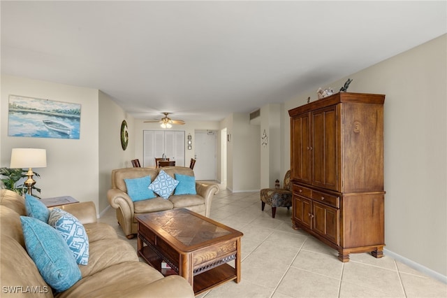 tiled living room featuring ceiling fan