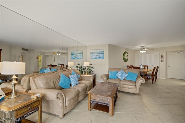 living room featuring ceiling fan and light tile patterned floors