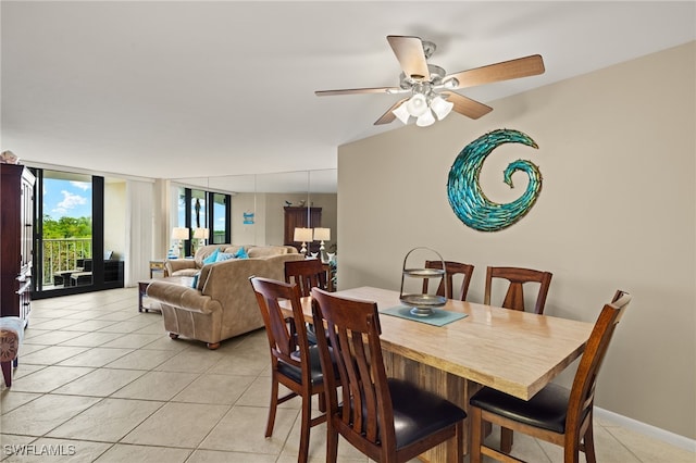 dining space with light tile patterned floors and ceiling fan