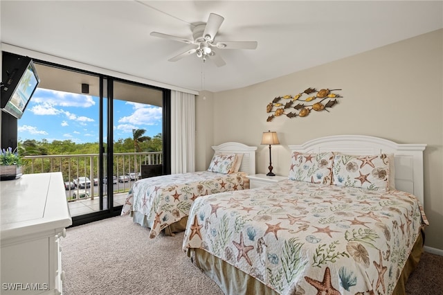 carpeted bedroom featuring access to exterior, ceiling fan, and a wall of windows