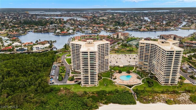 birds eye view of property with a water view