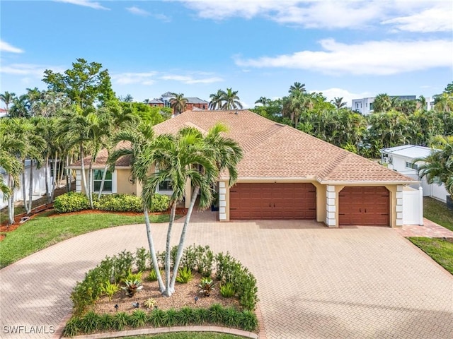 mediterranean / spanish-style home featuring a garage