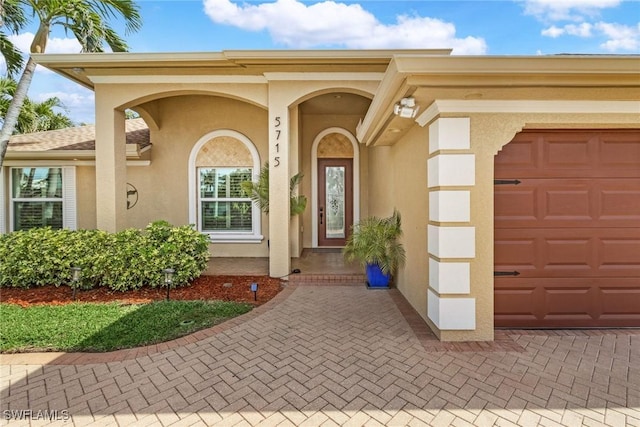 entrance to property featuring a garage