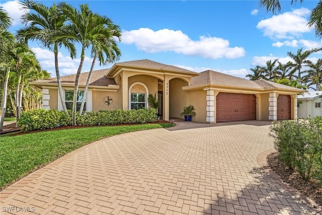 mediterranean / spanish-style house featuring a garage