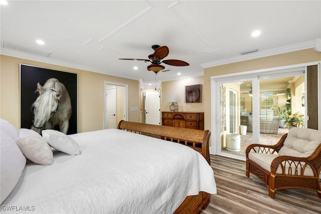 bedroom with hardwood / wood-style floors, ceiling fan, and crown molding