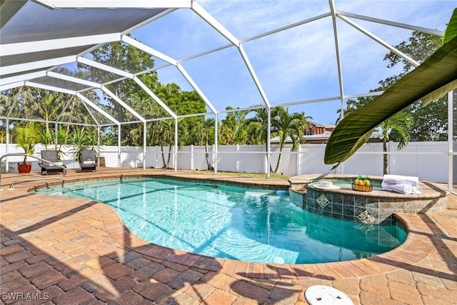 view of pool with a patio and a lanai