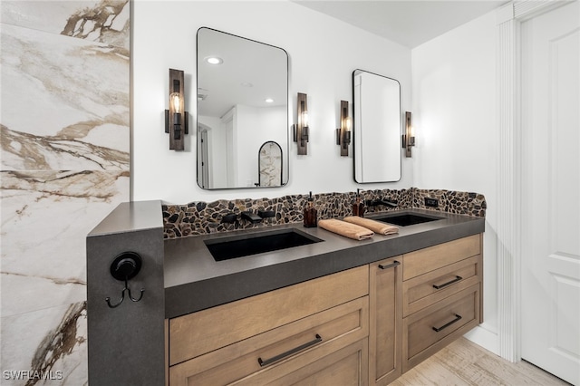 bathroom with vanity and hardwood / wood-style flooring