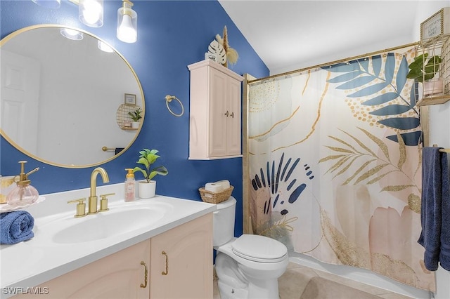 full bathroom featuring a shower with shower curtain, vanity, toilet, and tile patterned floors