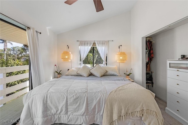 carpeted bedroom featuring lofted ceiling and ceiling fan