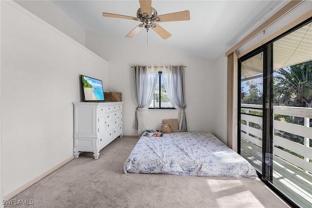 bedroom with a ceiling fan, carpet, vaulted ceiling, and baseboards