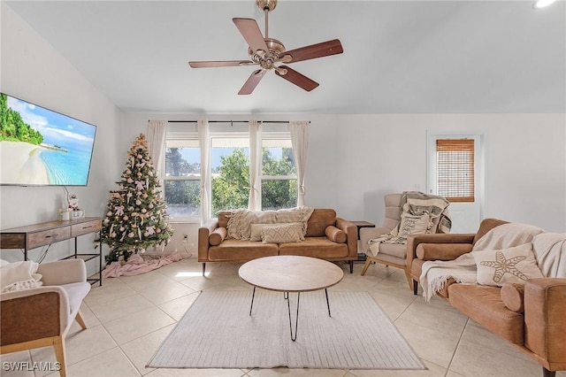 living area featuring light tile patterned flooring and a ceiling fan