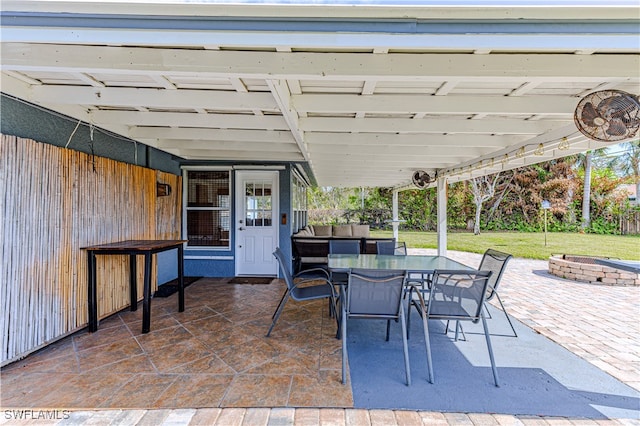 view of patio with a fire pit