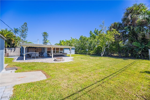 view of yard with a patio and a fire pit