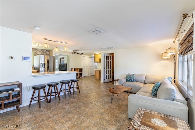 living room with ceiling fan