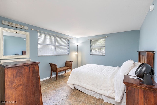 bedroom featuring light tile patterned floors