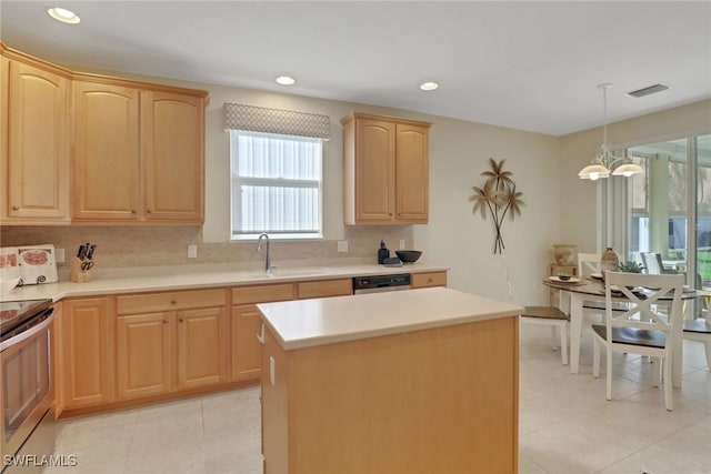 kitchen featuring pendant lighting, sink, appliances with stainless steel finishes, tasteful backsplash, and a kitchen island