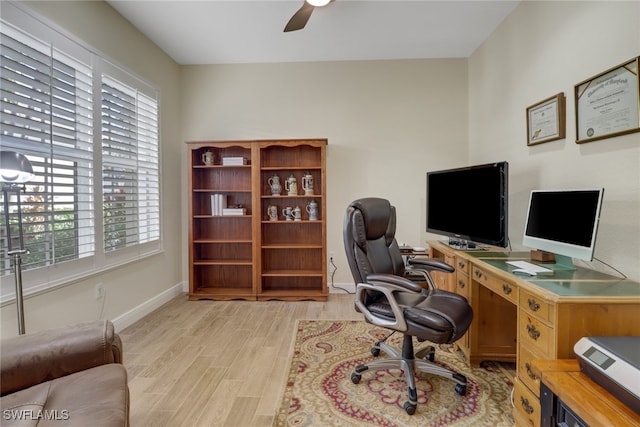 office area with ceiling fan, a healthy amount of sunlight, and light hardwood / wood-style flooring