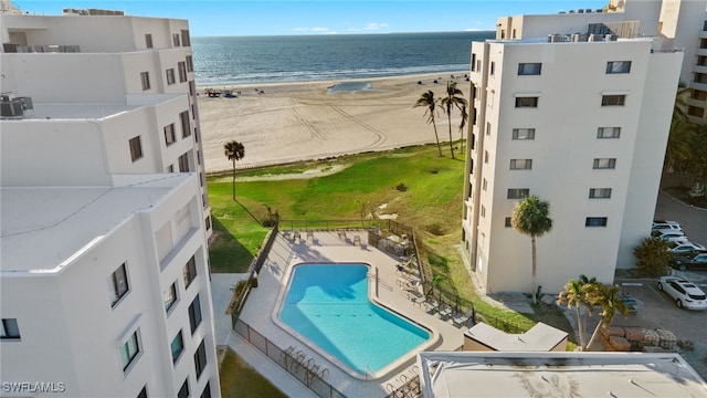 aerial view with a water view and a view of the beach