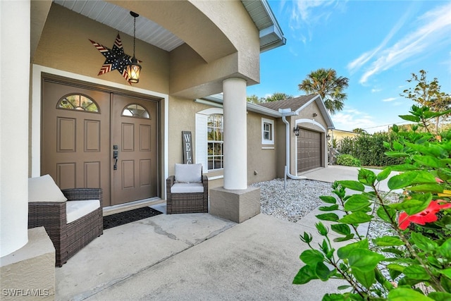 property entrance with covered porch and a garage