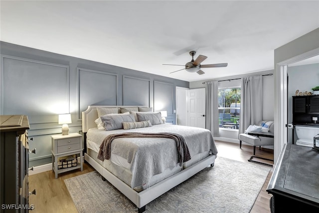 bedroom with ceiling fan and light wood-type flooring