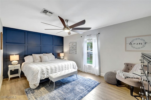 bedroom featuring light hardwood / wood-style flooring and ceiling fan