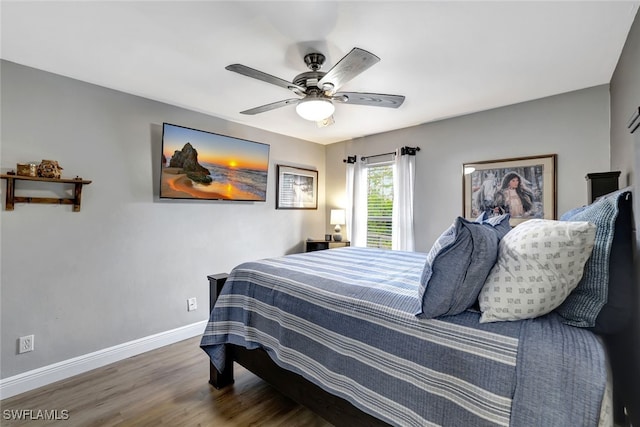 bedroom featuring ceiling fan and dark wood-type flooring