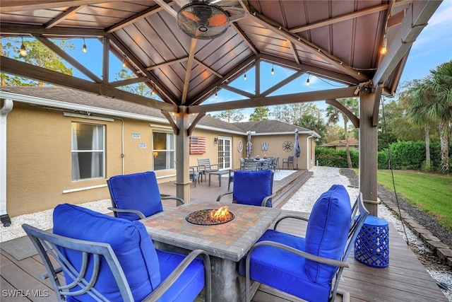 view of patio featuring a gazebo and a fire pit