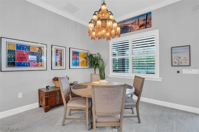 dining area with hardwood / wood-style flooring, a notable chandelier, and crown molding