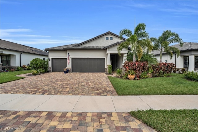 view of front facade with a front yard and a garage