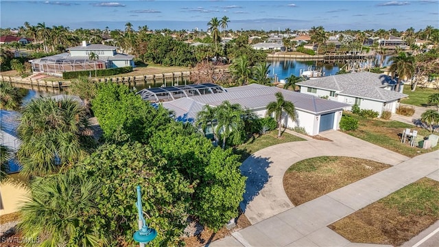 birds eye view of property featuring a water view